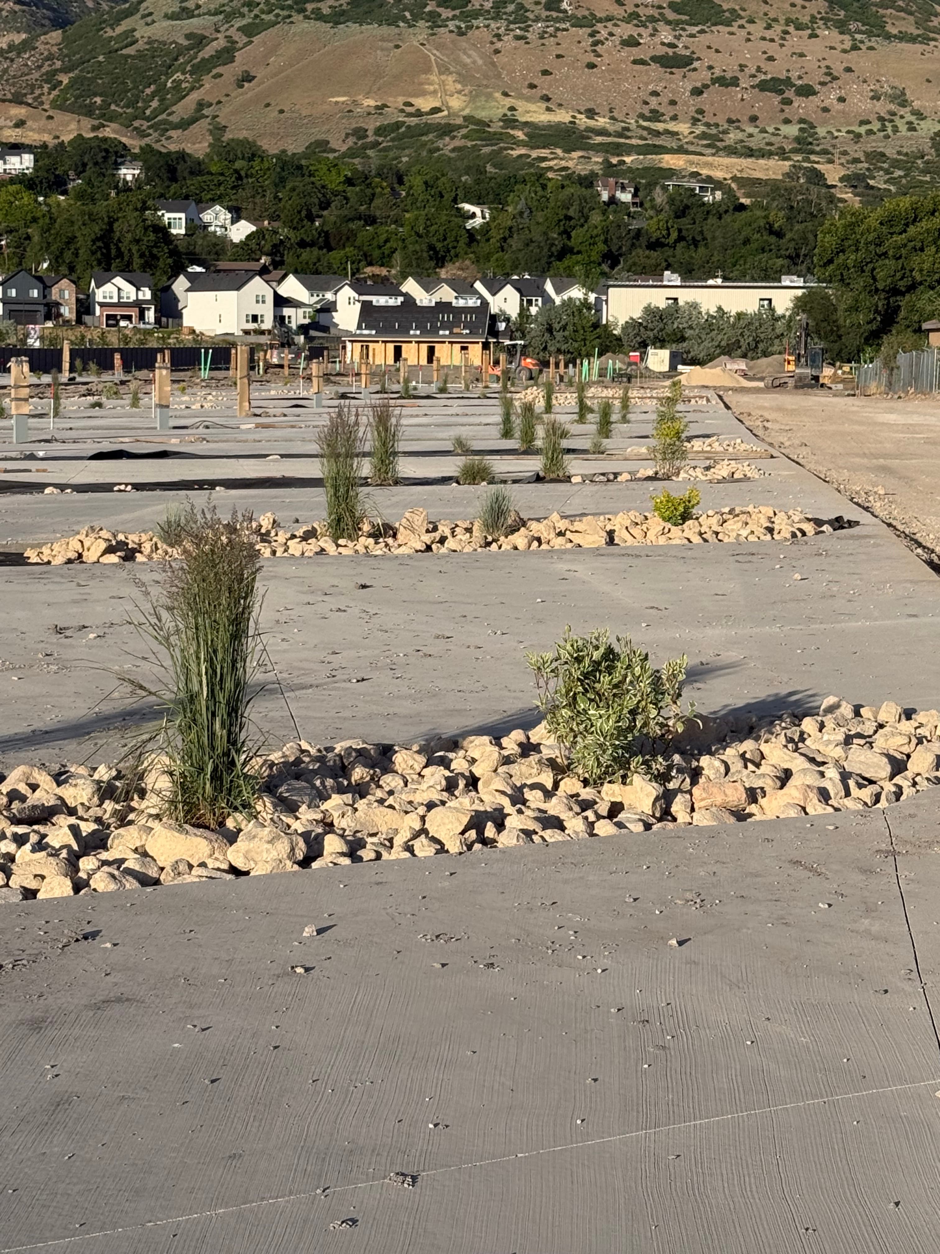 Spring Creek RV Resort concrete pad prepared for RV site with privacy fencing