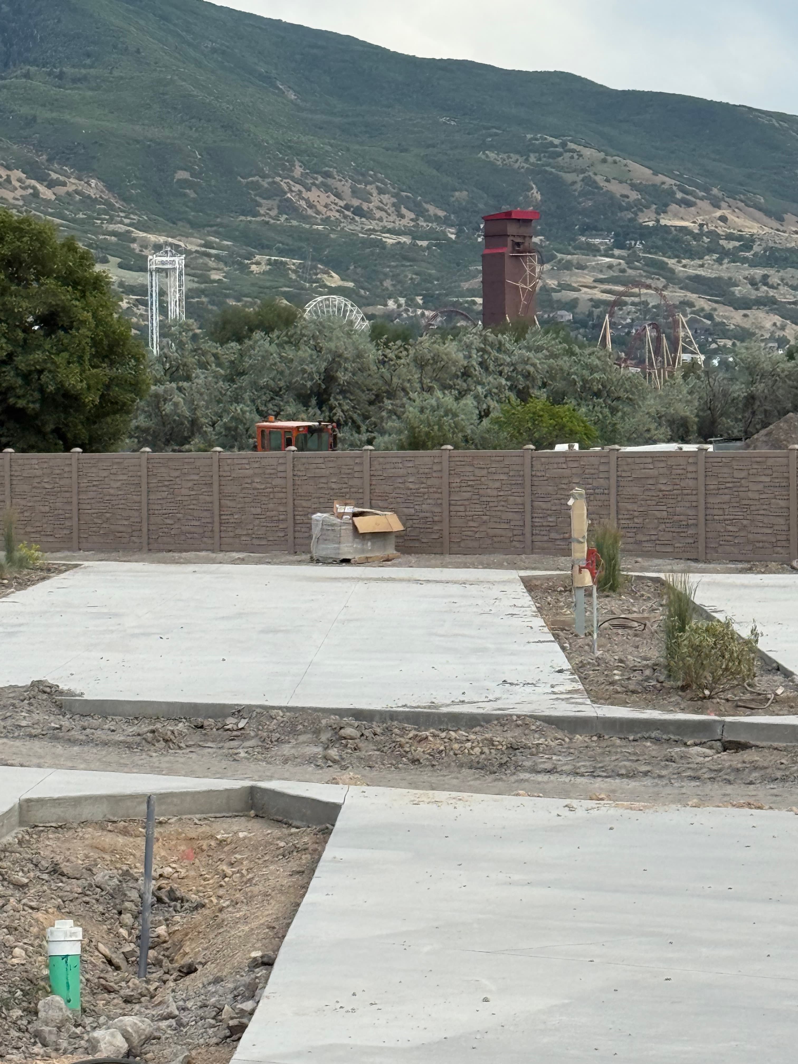 Spring Creek RV Resort aerial view with neighborhood and mountains in the distance