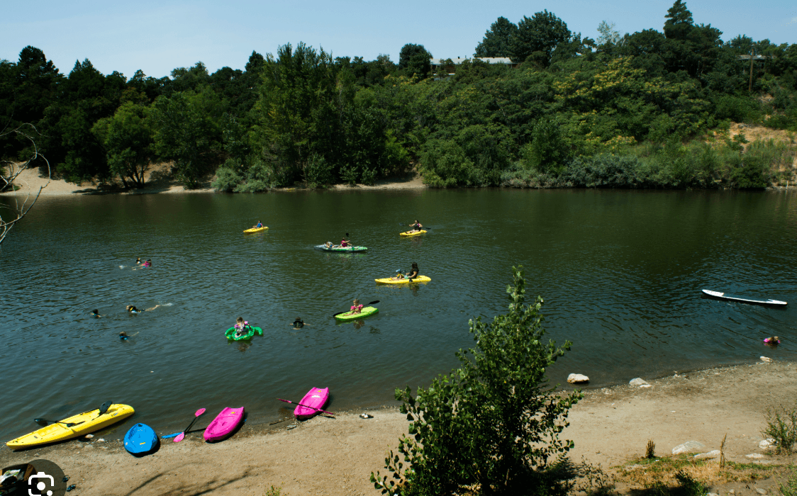 Farmington City Pond with kayakers and paddleboarders