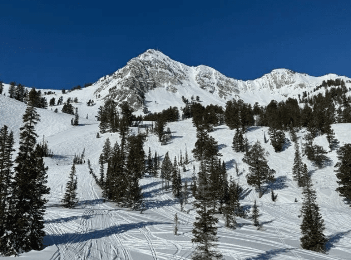 Snowbasin Ski Resort with snow-covered peaks and pine trees near Ogden, Utah
